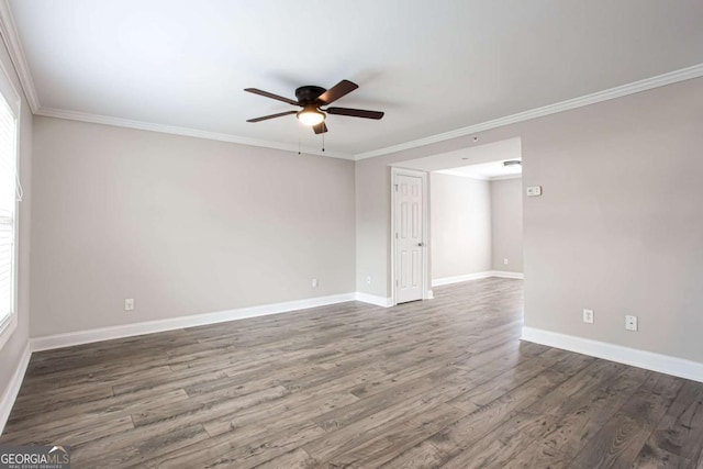 7 Villa Ct SE, Smyrna, GA 30080 - spare room with a ceiling fan, wood finished floors, crown molding, baseboards, and plenty of natural light