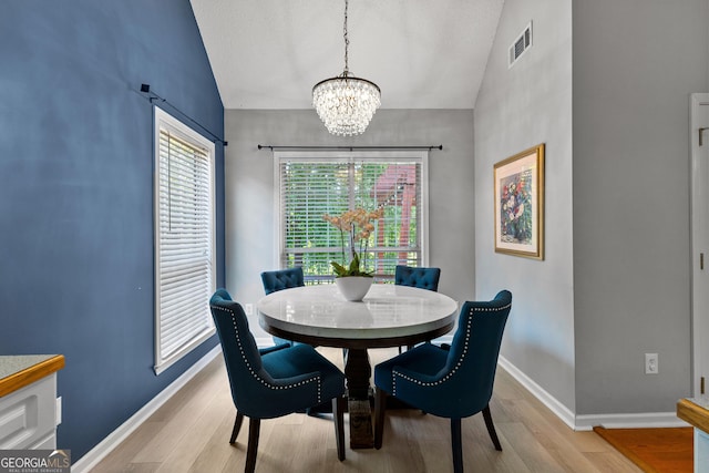 264 Baldwin Ct, Newnan, GA 30263 - dining space with a chandelier, lofted ceiling, and light wood-style floors