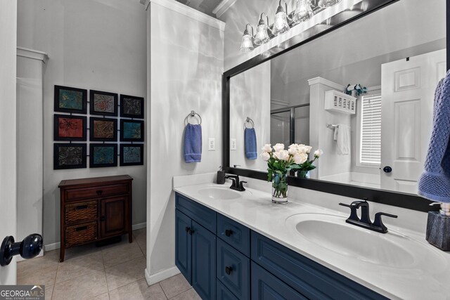 264 Baldwin Ct, Newnan, GA 30263 - full bathroom with double vanity, tile patterned floors, a shower with shower door, and ornamental molding