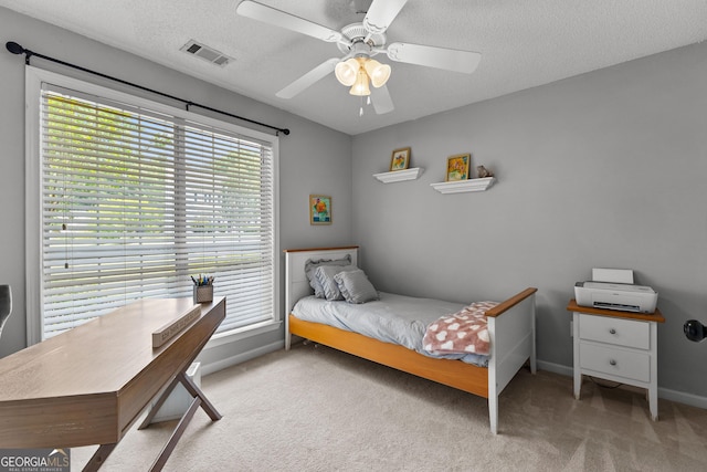 264 Baldwin Ct, Newnan, GA 30263 - bedroom featuring carpet flooring, a textured ceiling, ceiling fan, and a desk