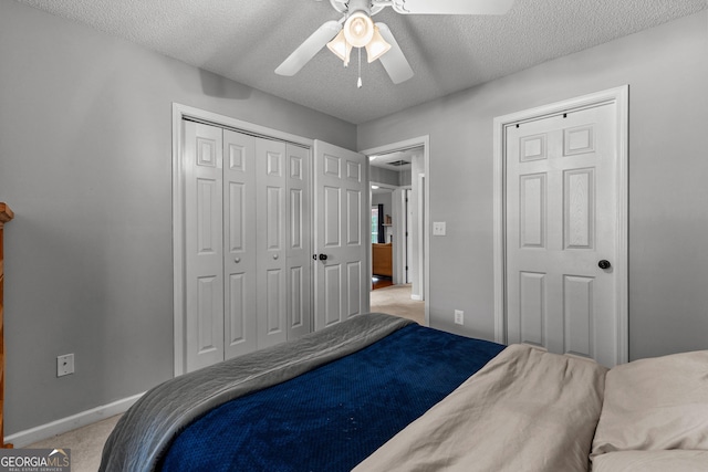 264 Baldwin Ct, Newnan, GA 30263 - bedroom featuring light colored carpet, a textured ceiling, a ceiling fan, and a closet