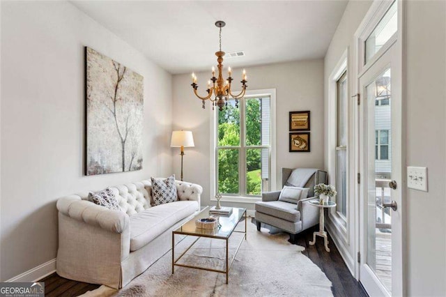 4355 Parkside Pl, Sandy Springs, GA 30342 - living room with a chandelier, wood finished floors, and baseboards