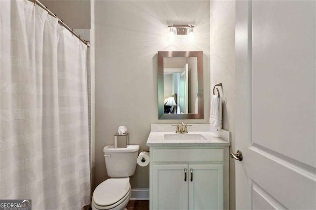 4355 Parkside Pl, Sandy Springs, GA 30342 - bathroom featuring toilet, vanity, and curtained shower