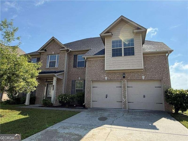 3488 Woodshade Dr, Loganville, GA 30052 - view of front facade with brick siding, driveway, a garage, and a front yard