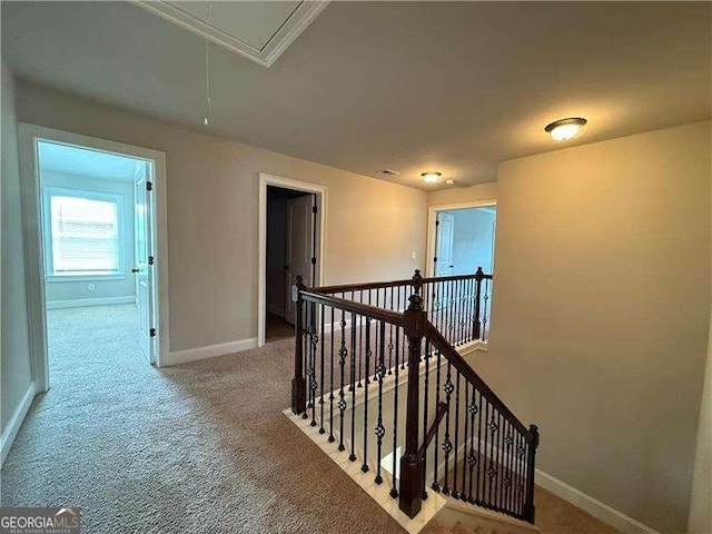 3488 Woodshade Dr, Loganville, GA 30052 - corridor featuring attic access, an upstairs landing, baseboards, and carpet flooring