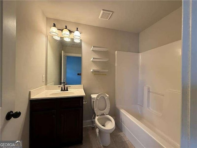 3488 Woodshade Dr, Loganville, GA 30052 - full bathroom with vanity, toilet, and  shower combination