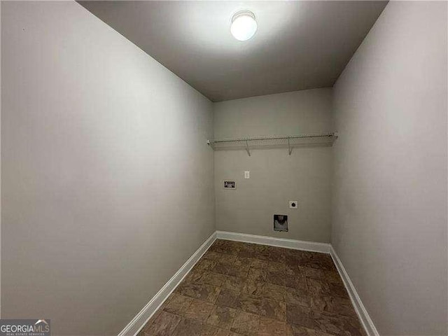 3488 Woodshade Dr, Loganville, GA 30052 - laundry room featuring hookup for an electric dryer and baseboards