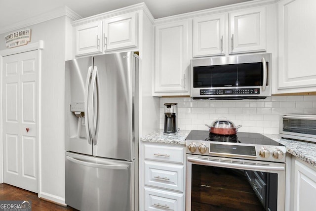 310 Medridge Dr, Alpharetta, GA 30022 - kitchen with stainless steel appliances, white cabinets, decorative backsplash, and crown molding