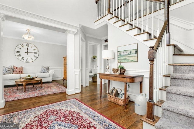 310 Medridge Dr, Alpharetta, GA 30022 - stairway with ornamental molding, wood finished floors, a decorative wall, a wainscoted wall, and decorative columns