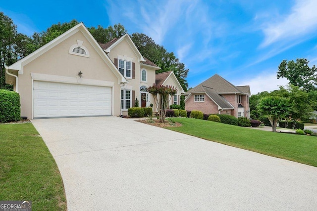 310 Medridge Dr, Alpharetta, GA 30022 - view of front of property with driveway, a garage, a front lawn, and stucco siding