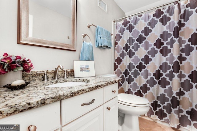 310 Medridge Dr, Alpharetta, GA 30022 - full bathroom with vanity, toilet, tile patterned flooring, and a shower with shower curtain