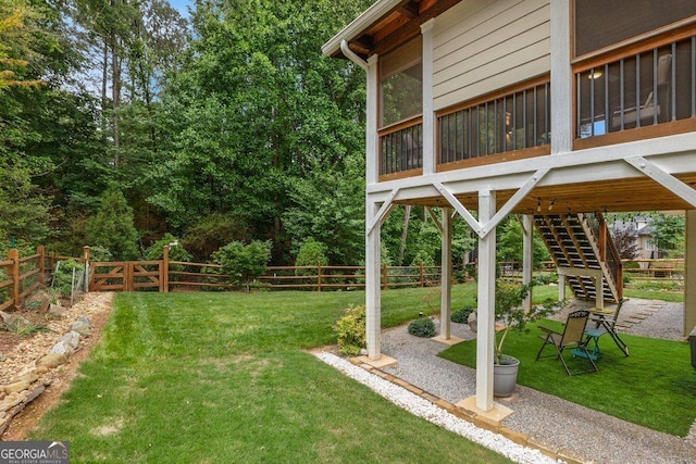 310 Medridge Dr, Alpharetta, GA 30022 - view of yard with stairs, a sunroom, and a patio area