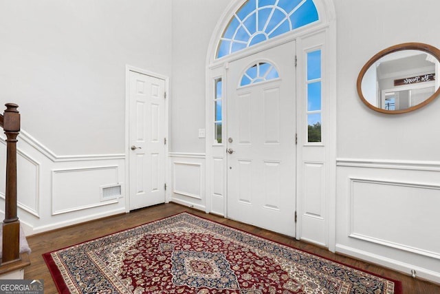 310 Medridge Dr, Alpharetta, GA 30022 - entryway with a decorative wall, wainscoting, and wood finished floors