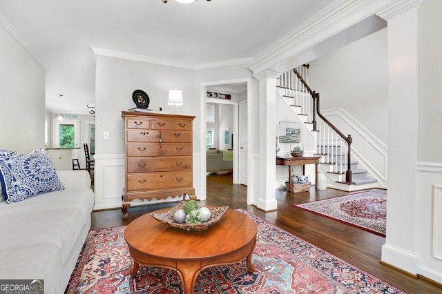 310 Medridge Dr, Alpharetta, GA 30022 - living area with wood finished floors, stairs, decorative columns, crown molding, and a decorative wall