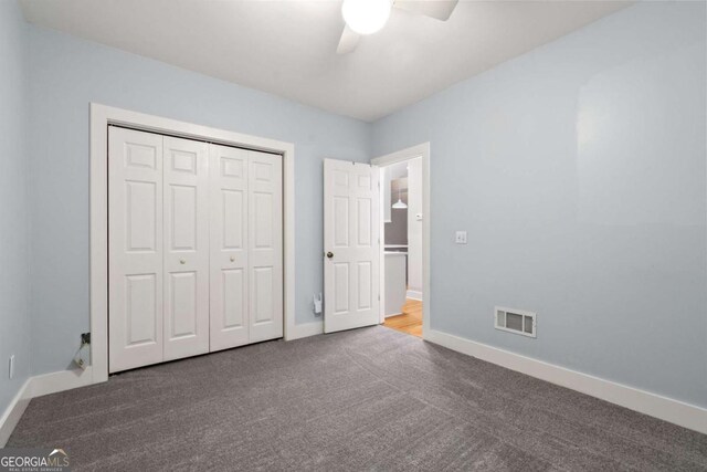 532 Coffee Cove Dr, Jasper, GA 30143 - unfurnished bedroom featuring carpet, baseboards, a closet, and ceiling fan
