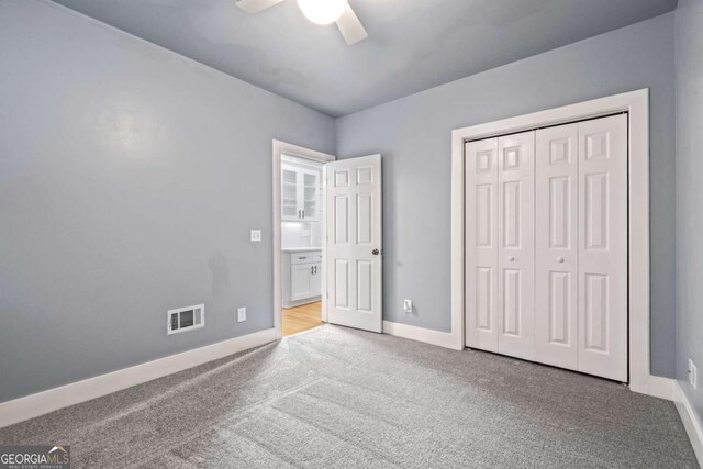 532 Coffee Cove Dr, Jasper, GA 30143 - unfurnished bedroom featuring carpet floors, baseboards, a closet, and a ceiling fan