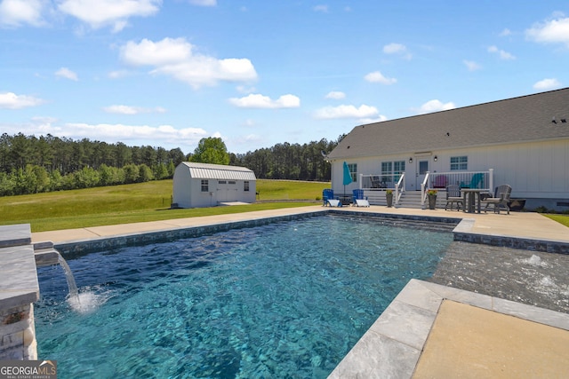 1035 Mcfarlin Bridge Rd, Carnesville, GA 30521 - swimming pool featuring a lawn, a deck, a storage unit, a patio, and a view of trees