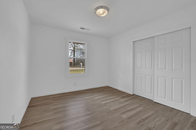 2030 Euclid St, Statham, GA 30666 - unfurnished bedroom with wood finished floors and a closet