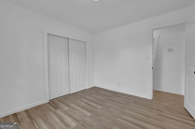 2030 Euclid St, Statham, GA 30666 - unfurnished bedroom with light wood-type flooring and a closet