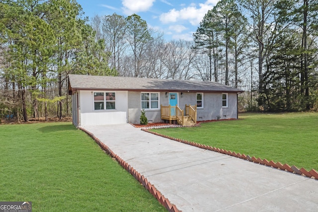 2030 Euclid St, Statham, GA 30666 - ranch-style house featuring concrete driveway, stucco siding, and a front yard