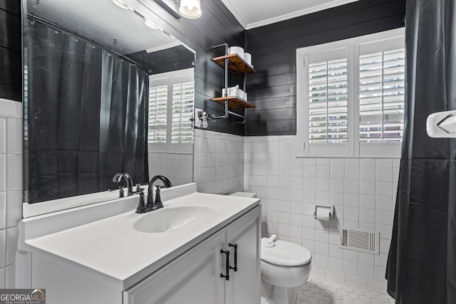 7121 Forest Dr SE, Covington, GA 30014 - full bathroom with tile walls, ornamental molding, vanity, a shower with curtain, and tile patterned floors