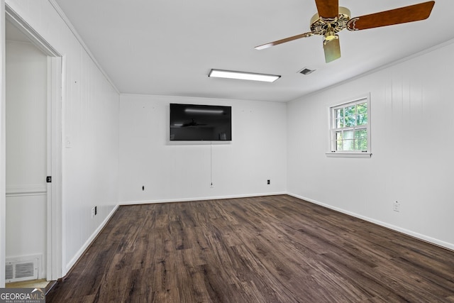 7121 Forest Dr SE, Covington, GA 30014 - unfurnished room featuring dark wood-style flooring, crown molding, and a ceiling fan