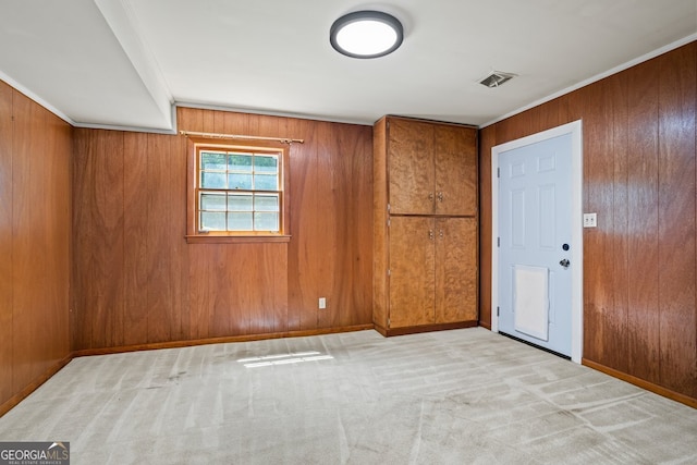 7121 Forest Dr SE, Covington, GA 30014 - carpeted spare room with wood walls