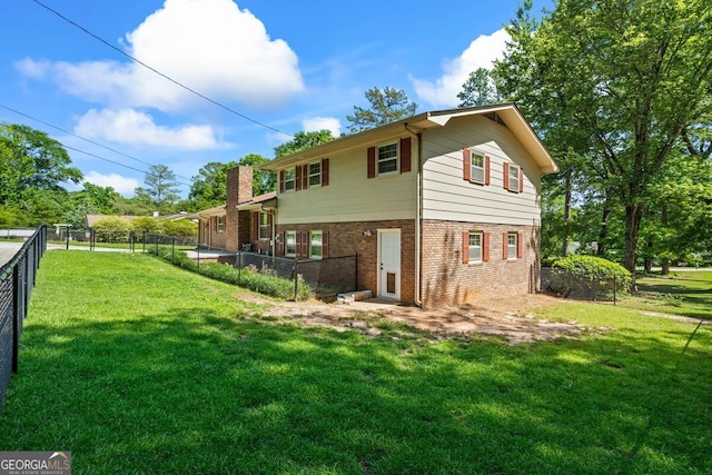 7121 Forest Dr SE, Covington, GA 30014 - back of house featuring brick siding, a fenced backyard, and a chimney