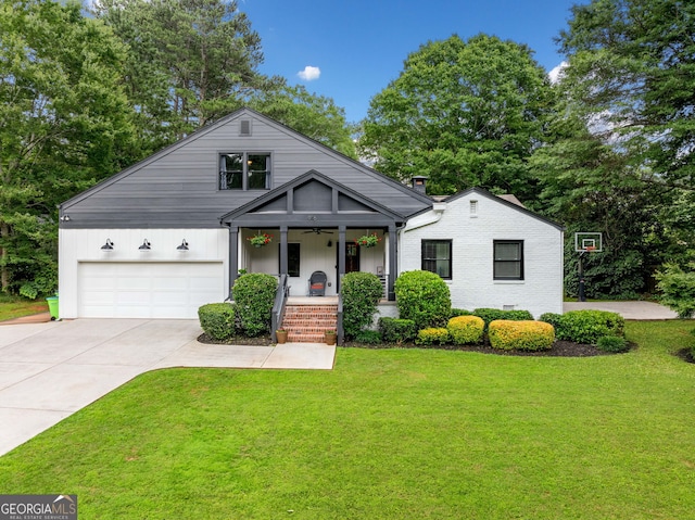 916 Stratford Rd, Avondale Estates, GA 30002 - view of front of house with covered porch, a front lawn, and driveway