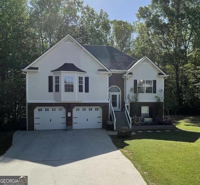 40 Legend Creek Chase, Douglasville, GA 30134 - bi-level home featuring an attached garage, a front yard, driveway, and brick siding