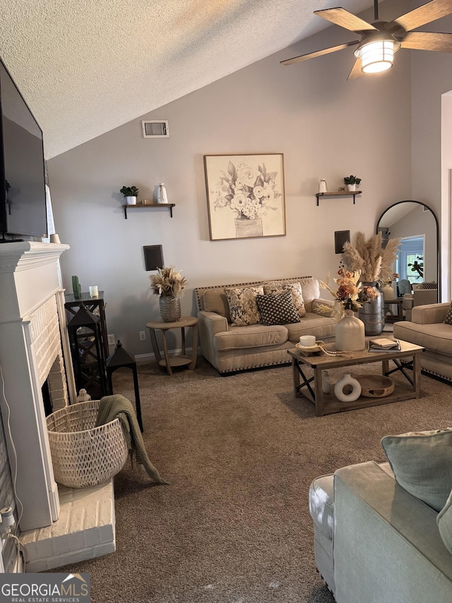 40 Legend Creek Chase, Douglasville, GA 30134 - carpeted living area with lofted ceiling, a textured ceiling, ceiling fan, and a brick fireplace