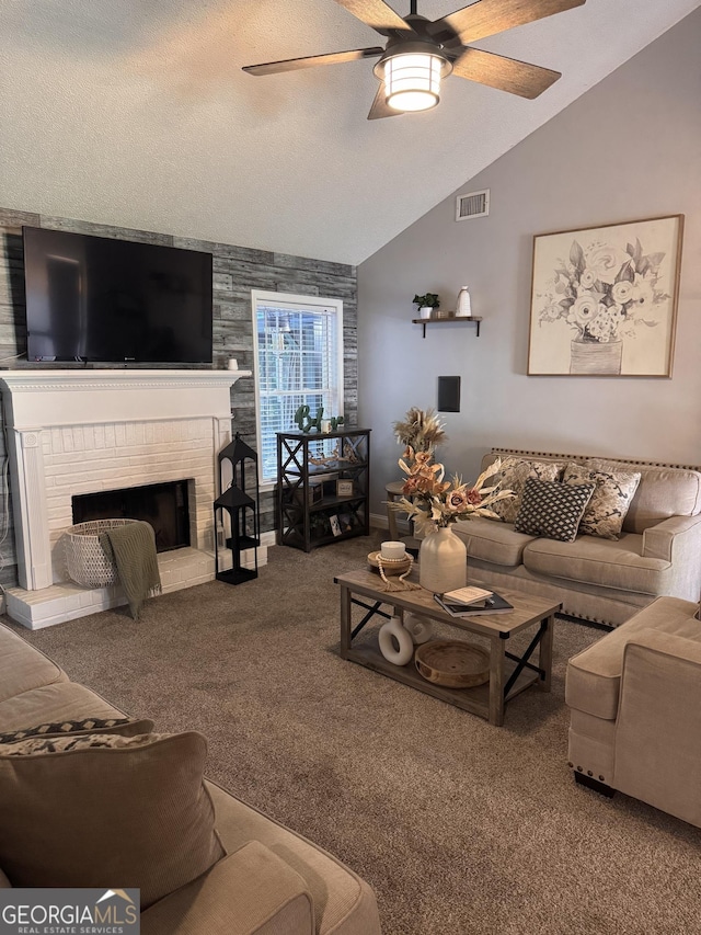 40 Legend Creek Chase, Douglasville, GA 30134 - carpeted living room with lofted ceiling, a ceiling fan, and a fireplace