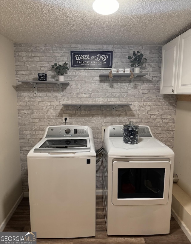 40 Legend Creek Chase, Douglasville, GA 30134 - washroom featuring separate washer and dryer, cabinet space, wood finished floors, a textured ceiling, and baseboards