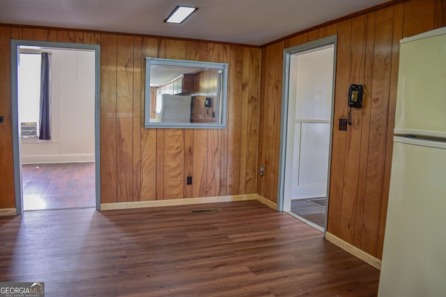100 Minor Ave, Montezuma, GA 31063 - empty room with wood walls, baseboards, wood finished floors, and crown molding