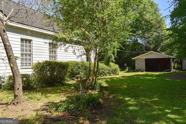 100 Minor Ave, Montezuma, GA 31063 - view of grassy yard featuring an outdoor structure