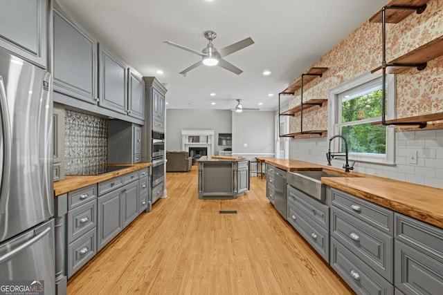 2230 Ewing Chapel Rd, Dacula, GA 30019 - kitchen featuring appliances with stainless steel finishes, gray cabinets, wood counters, ceiling fan, and recessed lighting