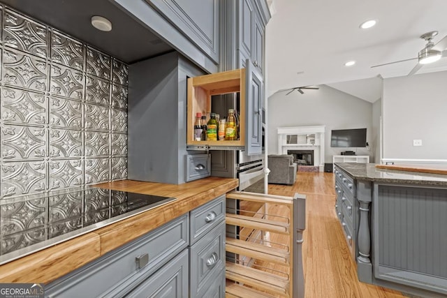 2230 Ewing Chapel Rd, Dacula, GA 30019 - kitchen featuring butcher block counters, gray cabinets, a ceiling fan, black electric cooktop, and light wood finished floors
