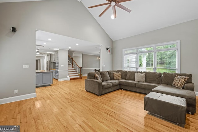 2230 Ewing Chapel Rd, Dacula, GA 30019 - living room featuring a ceiling fan, high vaulted ceiling, stairs, light wood-type flooring, and recessed lighting
