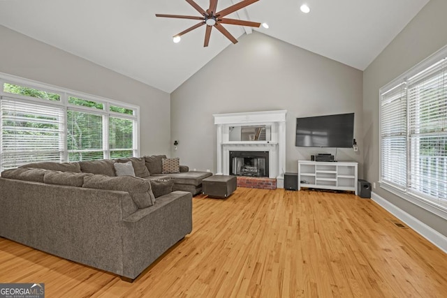 2230 Ewing Chapel Rd, Dacula, GA 30019 - living room featuring ceiling fan, light wood-style floors, a fireplace, recessed lighting, and high vaulted ceiling