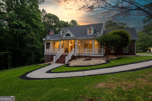 2230 Ewing Chapel Rd, Dacula, GA 30019 - view of front of house with a porch, a front yard, stairs, and a chimney
