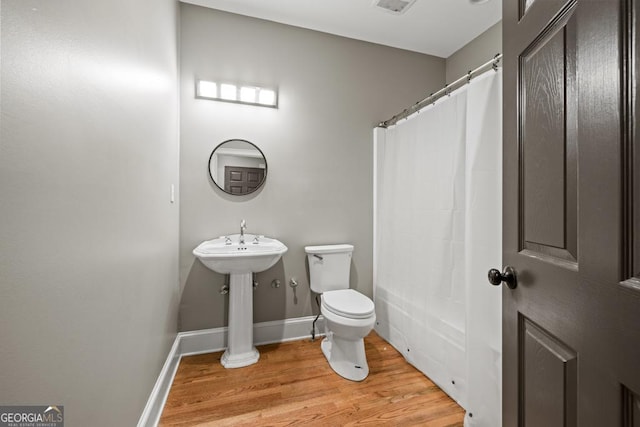 2230 Ewing Chapel Rd, Dacula, GA 30019 - full bath featuring toilet and wood finished floors
