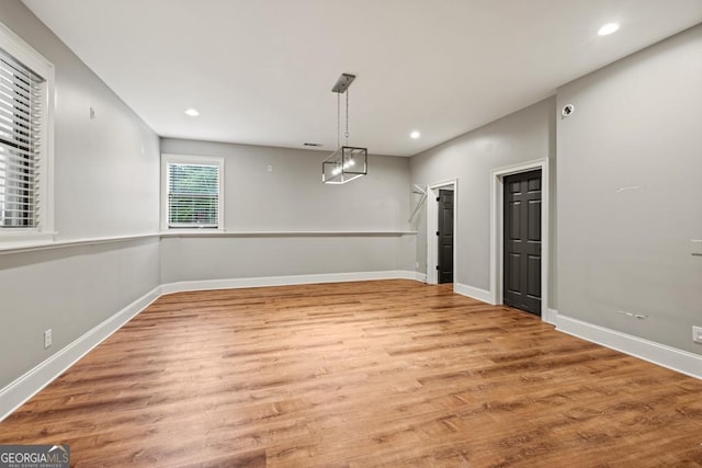2230 Ewing Chapel Rd, Dacula, GA 30019 - unfurnished dining area featuring wood finished floors, recessed lighting, and a chandelier