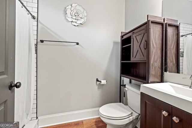 2230 Ewing Chapel Rd, Dacula, GA 30019 - full bath with vanity, a shower with shower curtain, and wood finished floors
