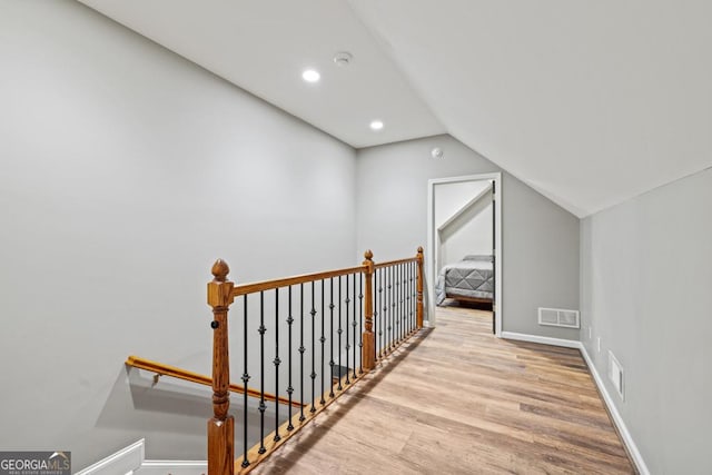 2230 Ewing Chapel Rd, Dacula, GA 30019 - hallway with wood finished floors, lofted ceiling, an upstairs landing, and recessed lighting