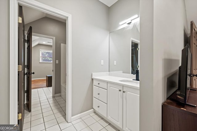 2230 Ewing Chapel Rd, Dacula, GA 30019 - bathroom with tile patterned flooring, vanity, and lofted ceiling