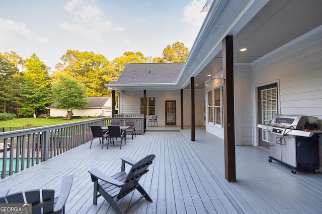 2230 Ewing Chapel Rd, Dacula, GA 30019 - wooden terrace with area for grilling and outdoor dining space