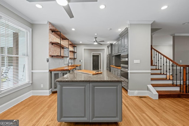 2230 Ewing Chapel Rd, Dacula, GA 30019 - kitchen featuring gray cabinetry, ceiling fan, ornamental molding, recessed lighting, and plenty of natural light