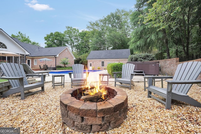 704 Branchview Ct, Mcdonough, GA 30252 - view of patio / terrace featuring a fire pit and a hot tub