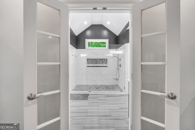 704 Branchview Ct, Mcdonough, GA 30252 - bathroom with lofted ceiling and a tile shower