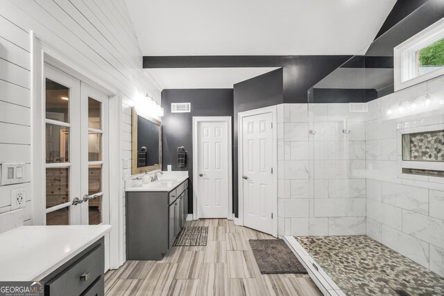704 Branchview Ct, Mcdonough, GA 30252 - bathroom with french doors, walk in shower, and vanity
